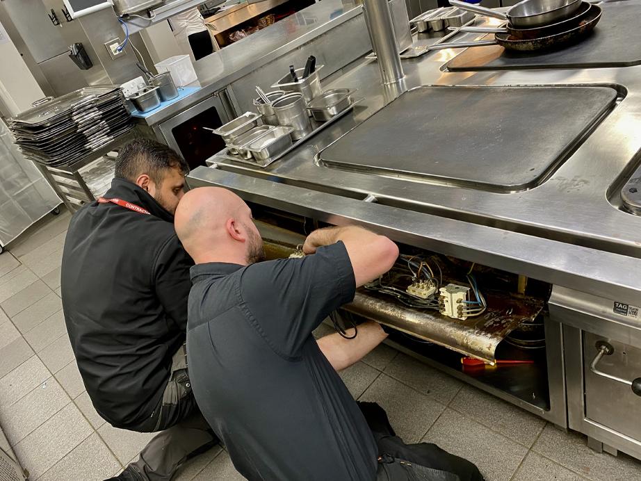 Technician repairing equipment