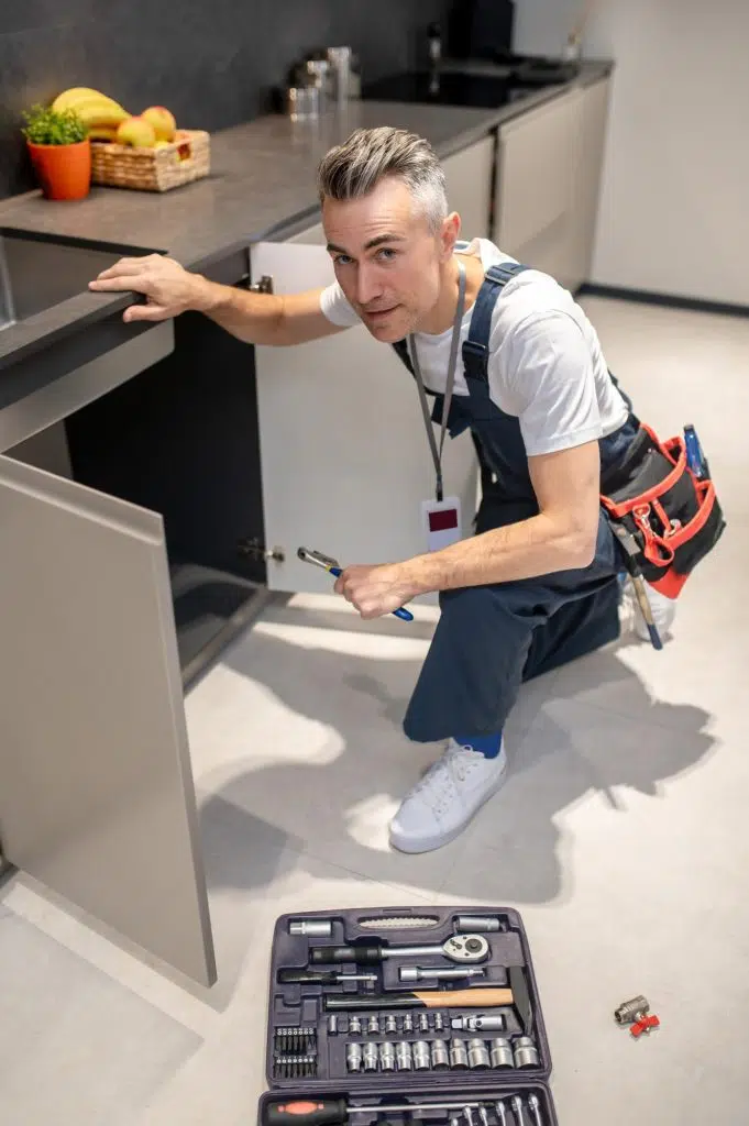 Technician working on kitchen equipment